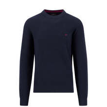 Load image into Gallery viewer, A navy blue ribbed knit crewneck sweater with a small red embroidered logo on the left chest, displayed on a clean white background.
