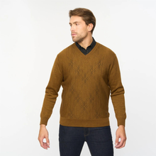 Load image into Gallery viewer, Man wearing a brown sweater with a subtle pattern on a white background
