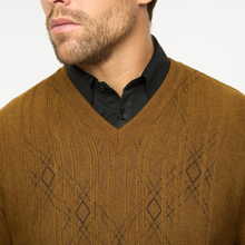 Load image into Gallery viewer, Man wearing a brown patterned sweater over a black shirt on a white background

