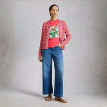 Load image into Gallery viewer, Woman wearing Graphic T-Shirt with cardigan with jeans on grey background 
