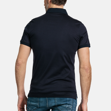 Load image into Gallery viewer, Rear view of Polo shirt on male model 
