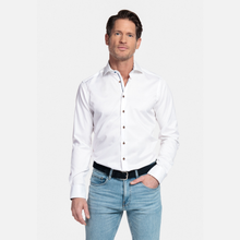 Load image into Gallery viewer, Man wearing a white dress shirt and light blue jeans on a white background
