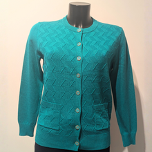 Load image into Gallery viewer, Front of Castle Knit Design Cardigan Evergreen, with a cream background.
