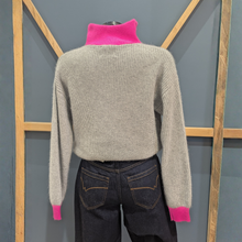 Load image into Gallery viewer, Back view of TWNS The Label Pearl Grey/Neon Pink, with a wooden and blue background.
