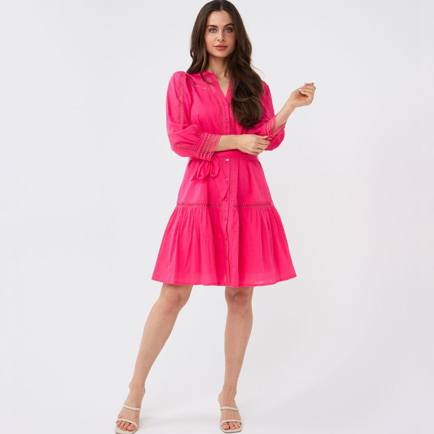 female model wearing esqualo lace dress in magenta colour looking at camera