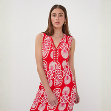 Load image into Gallery viewer, Woman wearing a red dress with white patterns on a white background
