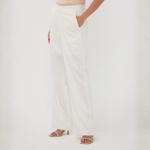 Load image into Gallery viewer, White pants worn by a person on a white background
