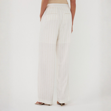 Load image into Gallery viewer, White striped pants worn by a person on a white background
