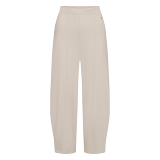 Front of jersey trousers in chalk color on a white background.