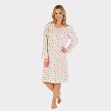 Load image into Gallery viewer, Model wearing a soft, heart print jersey nightdress, standing comfortably and smiling, showing relaxed fit and length.
