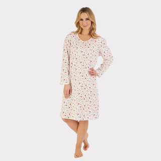 Model wearing a soft, heart print jersey nightdress, standing comfortably and smiling, showing relaxed fit and length.