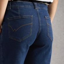 Load image into Gallery viewer, Close-up of blue jeans with a blurred background
