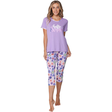 Load image into Gallery viewer, Woman wearing a purple pajama set with floral capri pants on a white background
