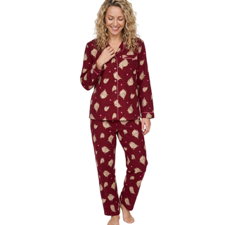 Pyjamas on model with highland cow motif in burgundy 