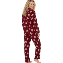 Load image into Gallery viewer, A woman modeling a two-piece long-sleeve pajama set with a burgundy base and a beige pine tree pattern, shown from a back-three-quarter angle against a plain white background.
