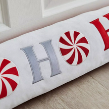 Load image into Gallery viewer, Decorative pillow with 'HOME' text and peppermint candy designs on a wooden surface.
