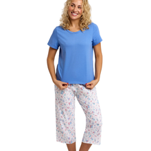 Load image into Gallery viewer, Woman wearing a blue top and patterned pants on a white background
