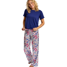Load image into Gallery viewer, Woman wearing a blue top and floral pants on a white background
