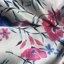 Load image into Gallery viewer, Close-up of floral fabric with pink and blue flowers on a white background
