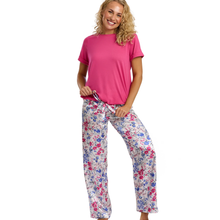 Load image into Gallery viewer, Woman wearing a pink top and floral pants on a white background
