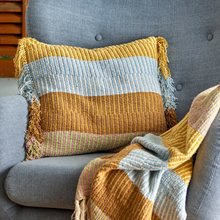 Load image into Gallery viewer, Textured pillow with fringes on a gray sofa
