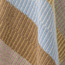 Load image into Gallery viewer, Close-up of a textured fabric with brown, blue, and pink patterns.
