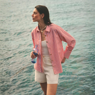 Lady in Stripe Shirt by the Water 