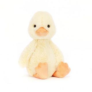 Fluffy yellow plush duck sitting facing camera.