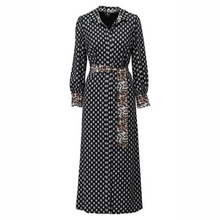 Load image into Gallery viewer, Long black and white patterned dress with a belt on a white background
