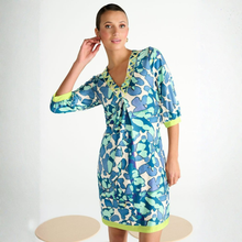Load image into Gallery viewer, Woman wearing a blue and green patterned dress on a white background
