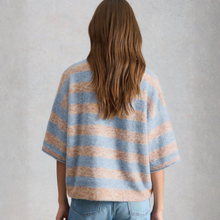 Load image into Gallery viewer, Back of Model, wearing White Stuff Kate Knitted Stripe Tee, in a Natural Colour, with a grey background.

