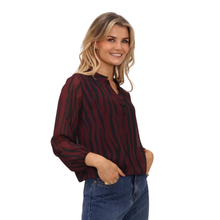 Load image into Gallery viewer, Model showcasing Kate &amp; Pippa Blouse in Black/Wine in a side view
