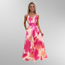 Load image into Gallery viewer, Model wearing Kate and Pipa maxi dress Lola in Pink and cream shades. One hand in the pocket.
