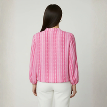 Load image into Gallery viewer, Woman in Pink Blouse with white trouser on pale background 
