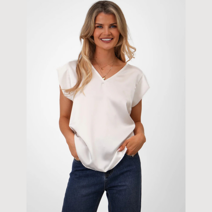 Lady in V Neck top and Jeans on white background