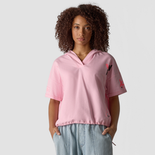 Load image into Gallery viewer, Woman wearing a pink hoodie with designs on a plain background
