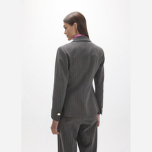 Load image into Gallery viewer, A woman shown from the back wearing a dark gray pinstripe blazer and matching trousers, with a pink shirt visible at the collar, against a plain light gray studio background.
