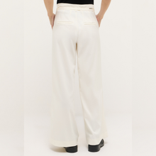 Load image into Gallery viewer, White wide-leg pants worn by a person on a white background
