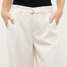 Load image into Gallery viewer, White pants worn by a person on a plain background
