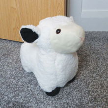 Load image into Gallery viewer, White Fluffy Sheep side view beside a door with black ear and black feet 
