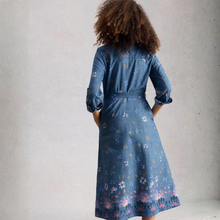 Load image into Gallery viewer, Woman wearing a blue floral dress against a plain background
