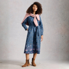 Load image into Gallery viewer, Woman wearing a blue floral dress with a pink scarf against a gray background
