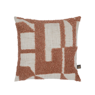 A square decorative throw pillow featuring a textured geometric pattern in terracotta brown and cream. The left side of the pillow has a shaggy, looped terracotta brown texture, while the right side and geometric shapes are made of a woven cream linen-like fabric.
