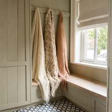 Load image into Gallery viewer, Wooden bench with three hanging blankets in a room with a window and patterned floor.
