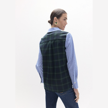 Load image into Gallery viewer, A woman shown from the back wearing a dark green and black plaid vest over a light blue and white striped button-down shirt, paired with dark blue jeans, against a plain white studio background.
