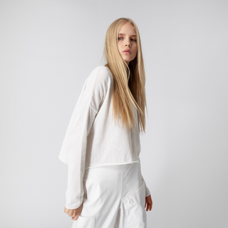 Person wearing a white outfit on a plain background