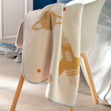 Load image into Gallery viewer, space print blanket over a chair 
