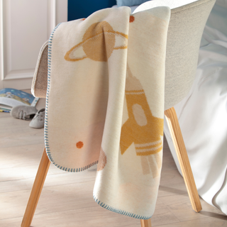 space print blanket over a chair 
