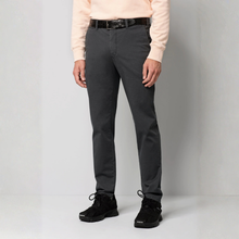 Load image into Gallery viewer, A person wearing slim-fit dark gray trousers, a light peach long-sleeve top, a black belt, and black sneakers, standing against a light gray studio background.

