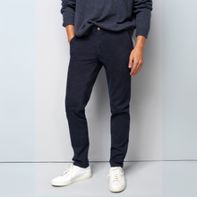 Load image into Gallery viewer, Person wearing navy pants and a gray sweater with white sneakers against a light gray background
